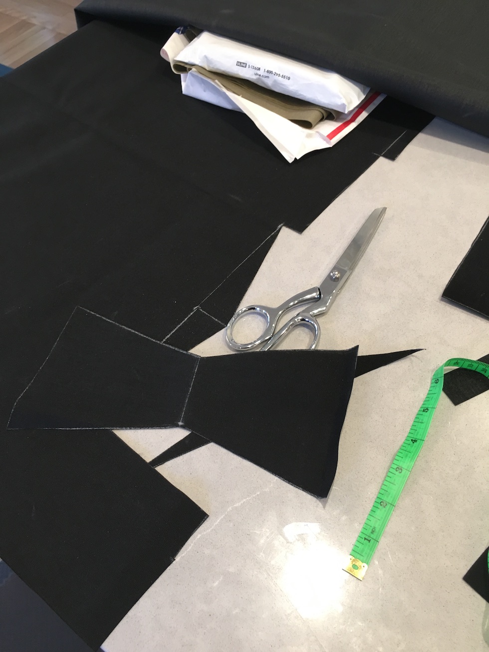 Cutting the tabs for the hip belt wings. Learning to make fewer cuts by folding to get two pieces for one.