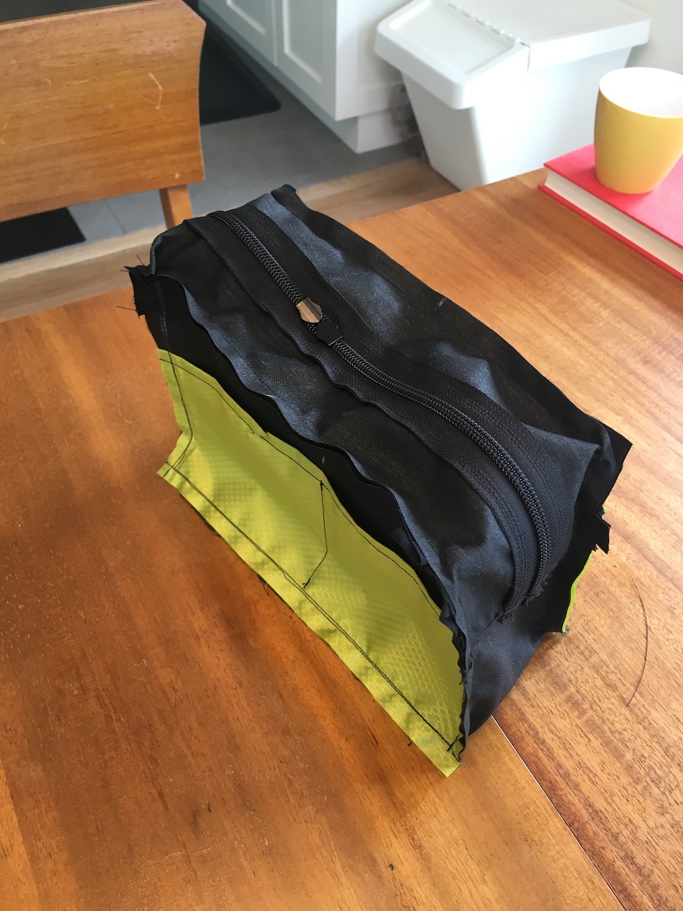 Skipped a few steps. Completed bag inside-out, just after finishing the back panel. The green ripstop is an internal divider pocket.